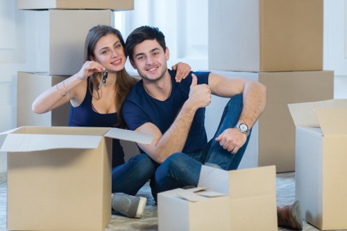 Furniture collection team handling bulky items in a Canary Wharf apartment building