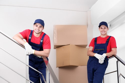 Team handling mixed recyclables and furniture for responsible transfer station processing