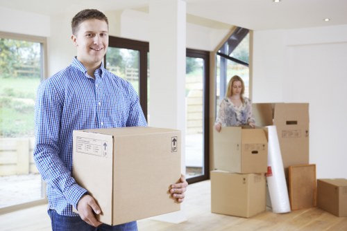 Man and van removals team near Canary Wharf apartment buildings
