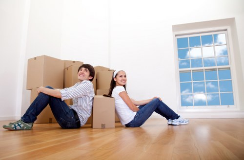 Professional movers preparing furniture for transport in Canary Wharf