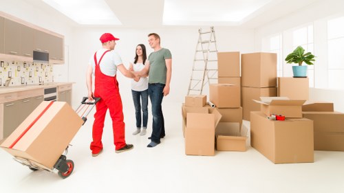 Van and mover handling a business relocation in Canary Wharf