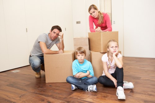 Packed boxes and furniture prepared for a removals van in Docklands