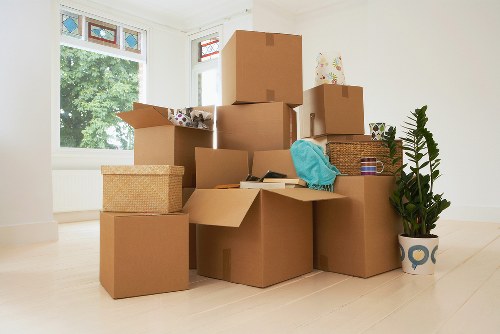Packaged office items and workspace equipment ready for relocation