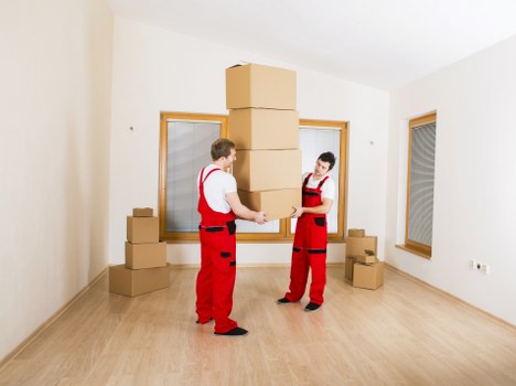 Local moving van serving Canary Wharf streets and loading bays